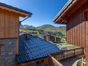 a view from the roof of a building with mountains in the background at Chalet Plagne Soleil, 4 pièces, 8 personnes - FR-1-351-83 in Plagne Villages