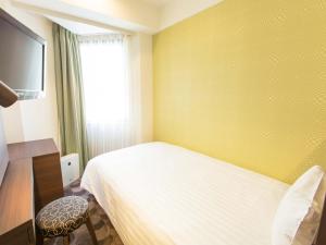 Postel nebo postele na pokoji v ubytování Shibuya Tobu Hotel