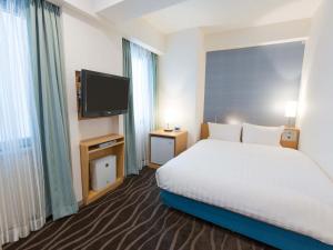 Postel nebo postele na pokoji v ubytování Shibuya Tobu Hotel
