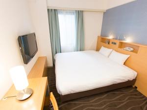 Postel nebo postele na pokoji v ubytování Shibuya Tobu Hotel