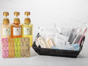 a basket with three bottles of soap and toothbrushes at Shibuya Tobu Hotel in Tokyo