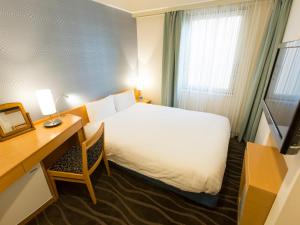 Postel nebo postele na pokoji v ubytování Shibuya Tobu Hotel