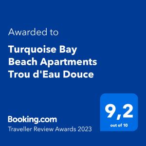 Um certificado, prêmio, placa ou outro documento exibido em Turquoise Bay Beach Apartments Trou d'Eau Douce
