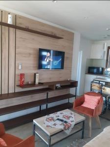 a living room with a flat screen tv on a wall at Boletov Raj in Čurug