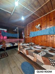 Ένα ή περισσότερα κρεβάτια σε δωμάτιο στο Odyssey Stays Mawlynnong
