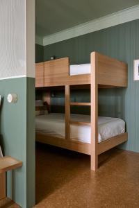 a bunk bed room with two bunk beds in it at River Drive Motel in Tarwin Lower