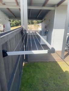 a deck with a metal railing on a house at Acacia Hills Retreat in Acacia Hills