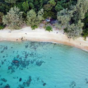 an aerial view of a beach with a body of water at KAMAKU Bungalows in Koh Rong Sanloem