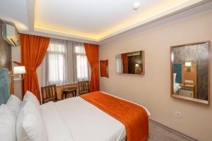 Postel nebo postele na pokoji v ubytování Hotel Devman