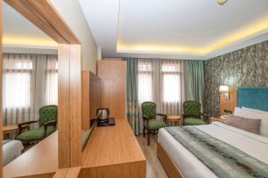 Postel nebo postele na pokoji v ubytování Hotel Devman