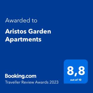 a blue sign with the text awarded to artists garden apartments at Aristos Garden Apartments in Kalithies