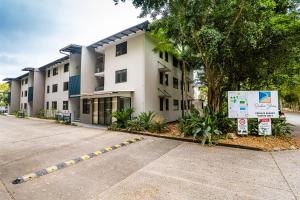 a building with a parking lot in front of it at Rainbow Shores - 2 Bedroom, modern apartment, sleeps 6, pool, walk to the beach in Rainbow Beach