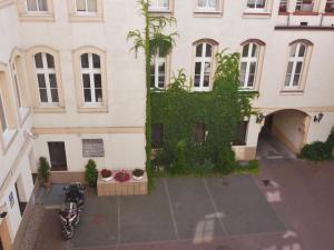 an overhead view of a building with a motorcycle parked in front at Willa Pod Aniołem in Inowrocław