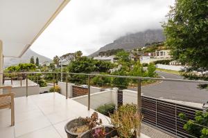 a balcony with a view of a mountain at Cape Blue in Cape Town