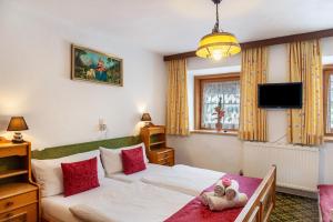 A bed or beds in a room at Ferienhaus Wechner