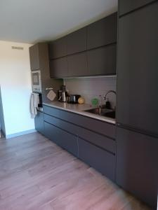 Кухня или кухненски бокс в Chambre dans Bel appartement spacieux