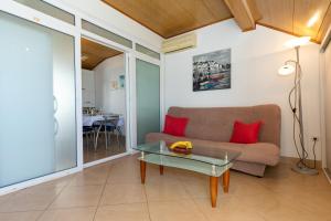 a living room with a couch and a table at Strandhaus Vesna WG 2 in Klek +7 photos
