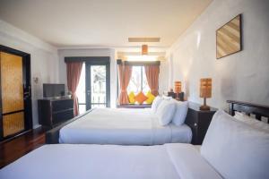 Postel nebo postele na pokoji v ubytování Punnpreeda Beach Resort - SHA Plus Certified