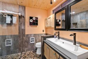 a bathroom with a sink and a toilet at High View Haven - Hot Tub, Fire Pit & BBQ in Joshua Tree! home in Joshua Tree +22 photos