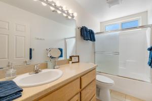 a bathroom with a sink and a shower and a toilet at Colorful Cactus - Hot Tub, BBQ and Fire Pit! home in Joshua Tree