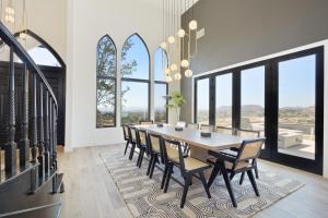 a dining room with a table and chairs and windows at Chateau Evie James -High End Luxury Home withPool,Hot Tub,Gameroom home in Temecula +45 photos