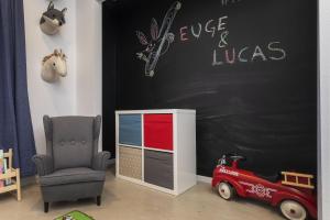 a childs room with a toy car and a chair at Cosmic Rabbit - Family fun with hot tub!! home in Joshua Tree