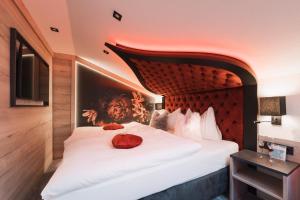 a hotel room with a bed with a pumpkin on it at Alp Larain B&B in Ischgl