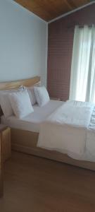Katil atau katil-katil dalam bilik di Rosa B&B