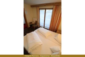 Letto o letti in una camera di Ferienhotel Fuchs