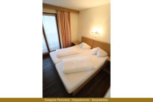 Letto o letti in una camera di Ferienhotel Fuchs