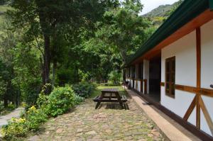 a picnic table on the side of a building at The Lodge at Galapitiyaya Estate in Haputale