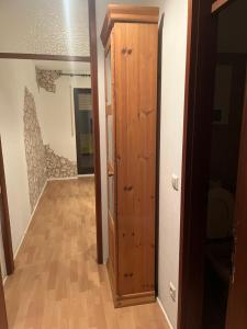 a hallway with a wooden door in a room at Mira in Gernsbach