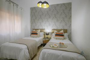 Posteľ alebo postele v izbe v ubytovaní Living4Malaga Málaga Centre Premium