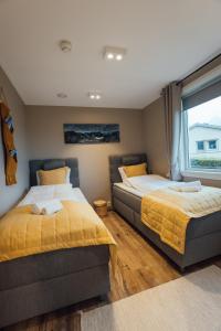 Postel nebo postele na pokoji v ubytování Lofoten Planet - Boutique Hotel