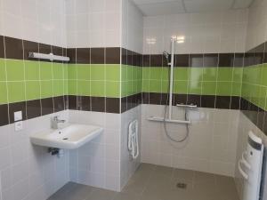a bathroom with a sink and a shower at Ô Doubs Chalets in Mouthe +16 photos