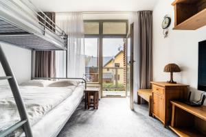 Postel nebo postele na pokoji v ubytování Apartmán Harrachov 608