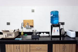 a kitchen counter with a sink and a blender at Satsang Homestay in Kathmandu +8 photos
