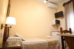 Ein Bett oder Betten in einem Zimmer der Unterkunft Hostal Rocio