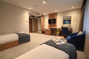 Posteľ alebo postele v izbe v ubytovaní Hotel Foldana