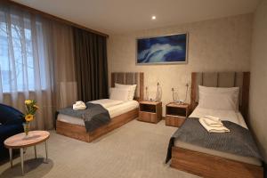 Posteľ alebo postele v izbe v ubytovaní Hotel Foldana