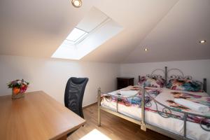 a bedroom with a bed and a table and a window at Apartment in Ika with sea view, balcony, air conditioning, WiFi 5025-2 in Ika