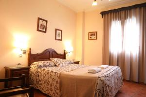 Ein Bett oder Betten in einem Zimmer der Unterkunft Hostal Rocio