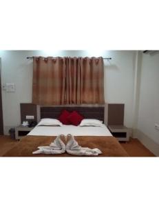 Ένα ή περισσότερα κρεβάτια σε δωμάτιο στο Rishi Garden, Shivpuri
