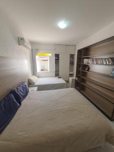 Katil atau katil-katil dalam bilik di Casa Charme Barra de São Miguel (5 Suítes com ar)