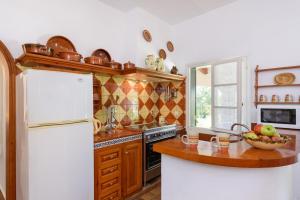 A kitchen or kitchenette at Villa La Martina