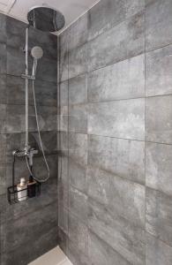 A bathroom at Stylish apartments with balcony & parking near the beach by REMS