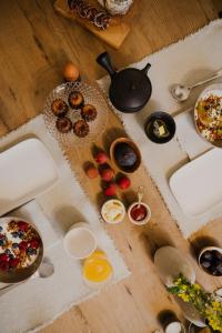 a table with eggs and other food on it at Das Edith in Stuttgart