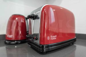 Coffee and tea making facilities at Stylish apartments with balcony & parking near the beach by REMS