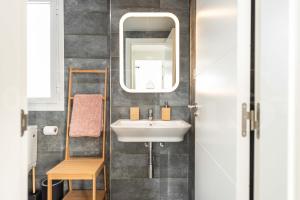 A bathroom at Stylish apartments with balcony & parking near the beach by REMS