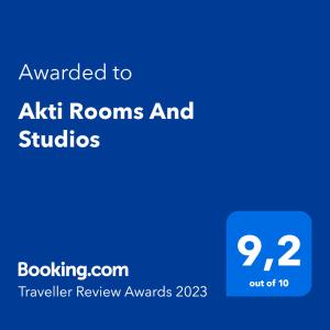 a blue text box with the words awarded to akitz rooms and studies at Akti Rooms And Studios in Livadion